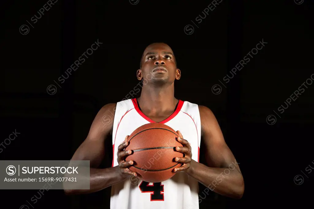 Basketball player preparing to shoot basketball, portrait