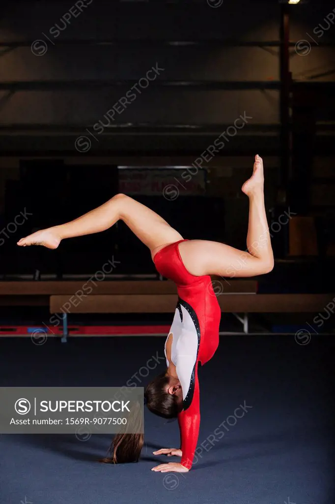 Gymnast performing handstand