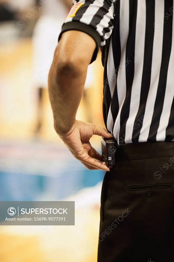 Basketball referee, cropped rear view