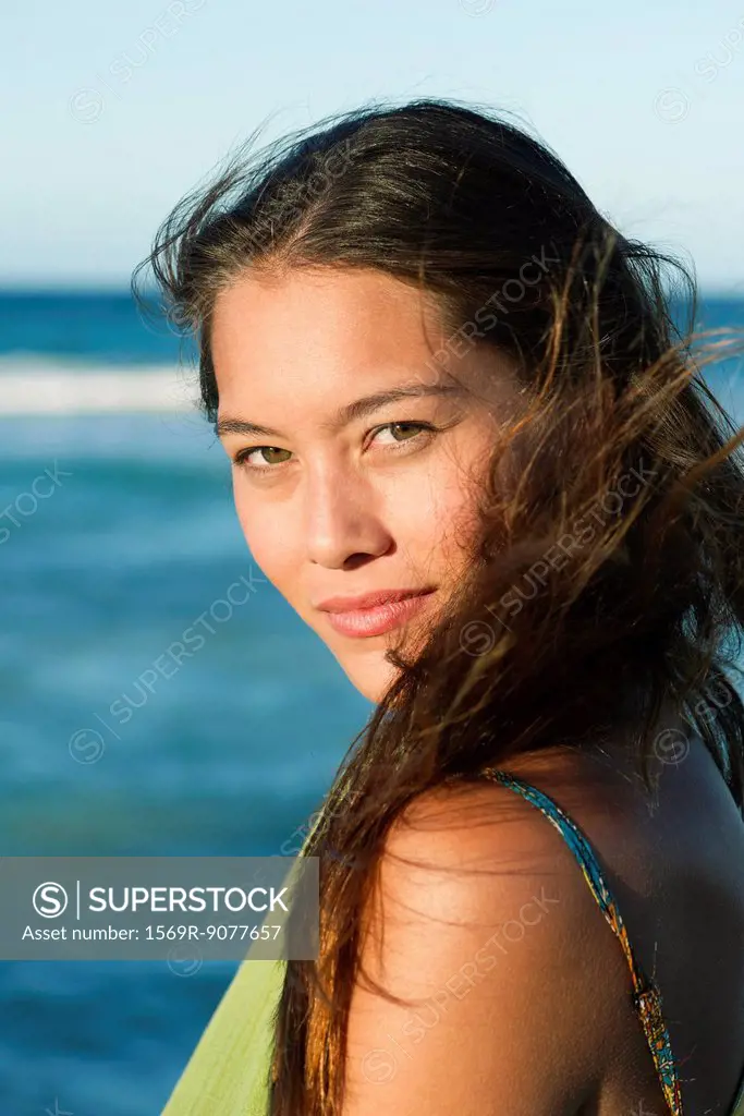 Young woman by sea, portrait
