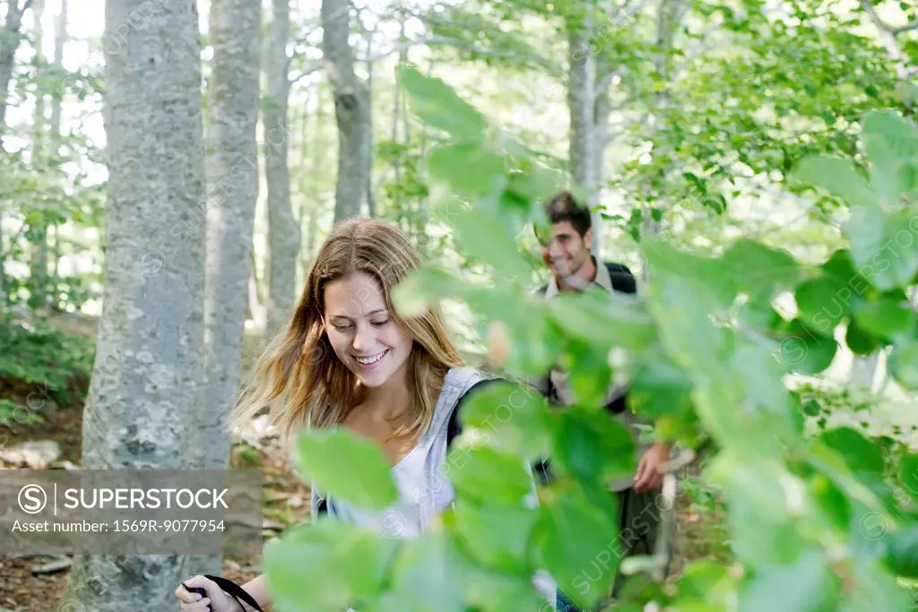 Young couple hiking in woods