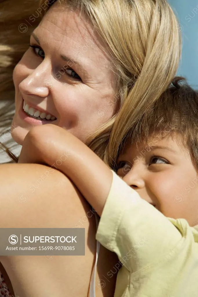 Mother and son spending time together outdoors, portrait