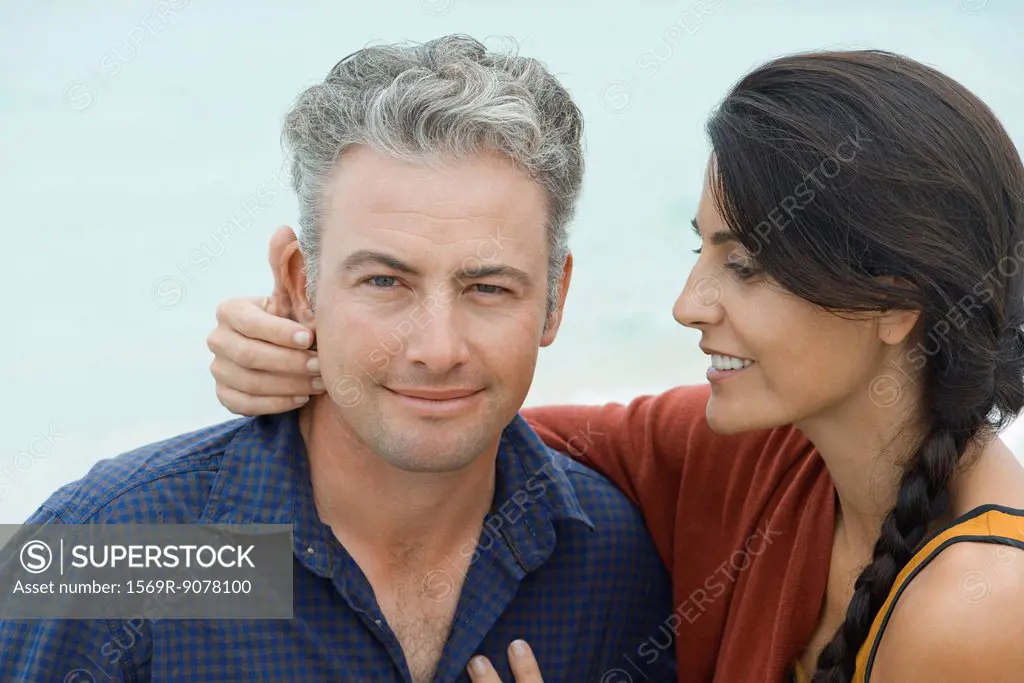 Woman looking affectionately at husband, portrait