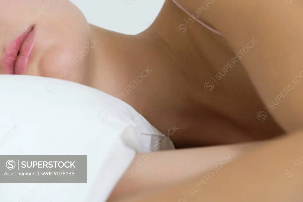 Woman lying on side, cropped