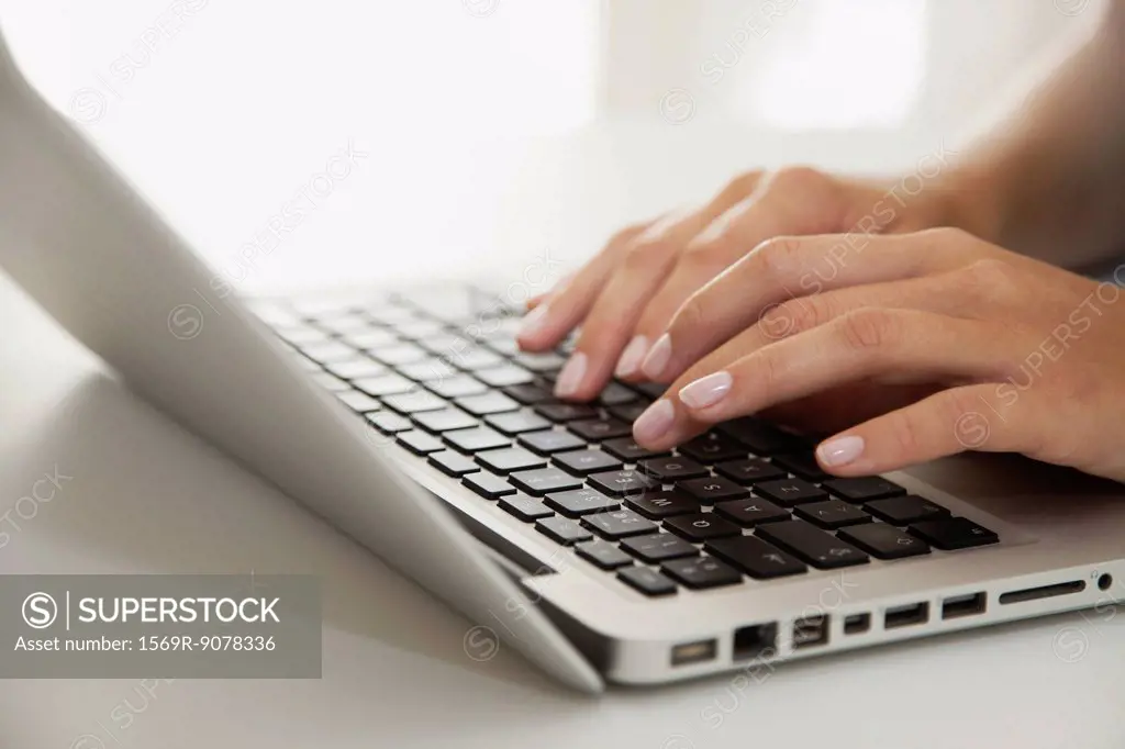 Woman´s hands typing on laptop computer