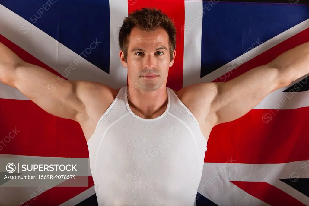 Male athlete in front of British flag, portrait