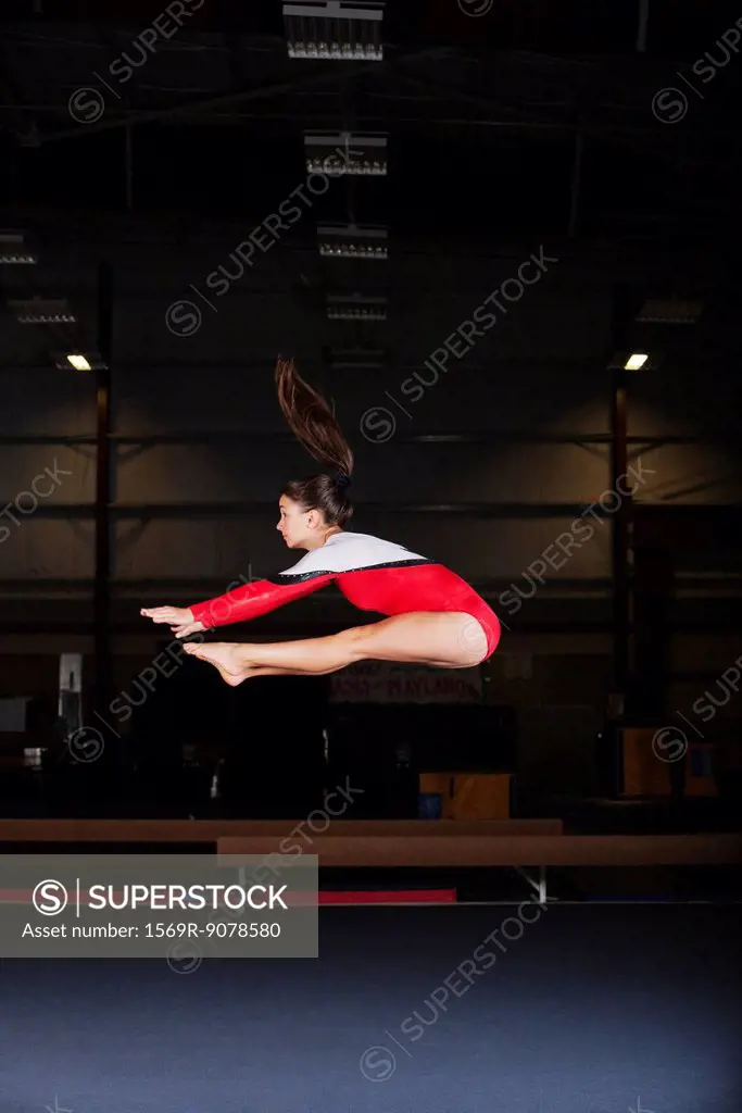 Gymnast jumping in air