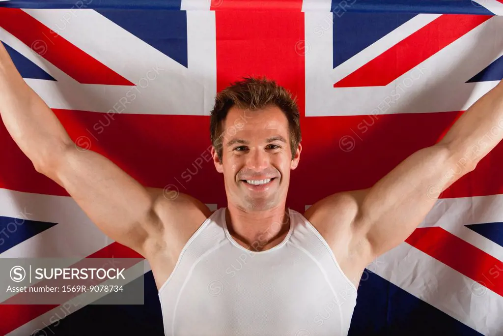 Male athlete in front of British flag