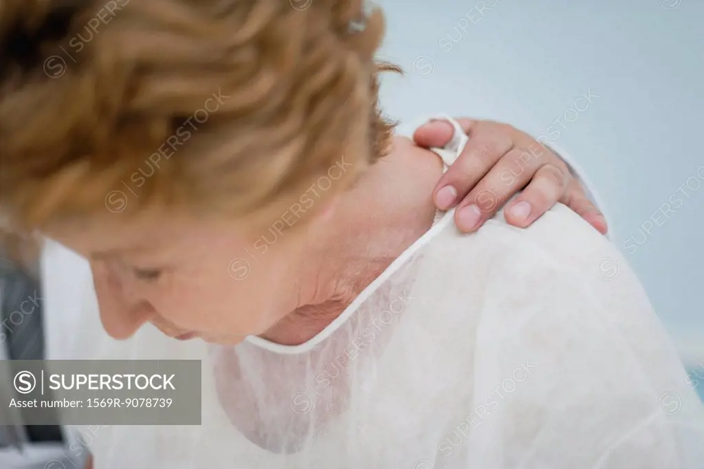 Senior woman receiving bad news from doctor, cropped