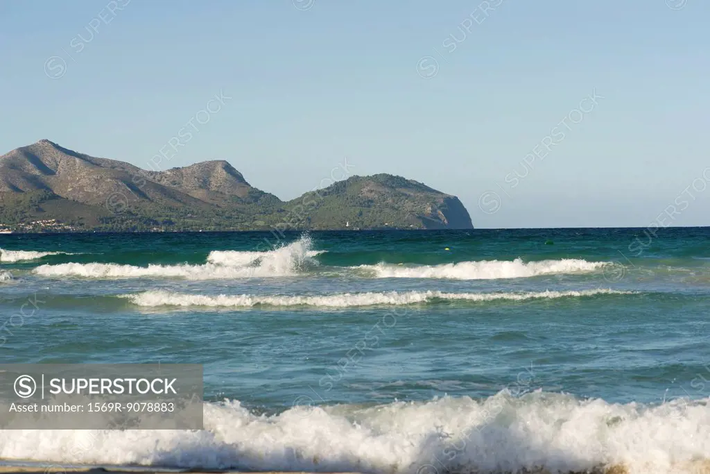 View of ocean, mountain in background