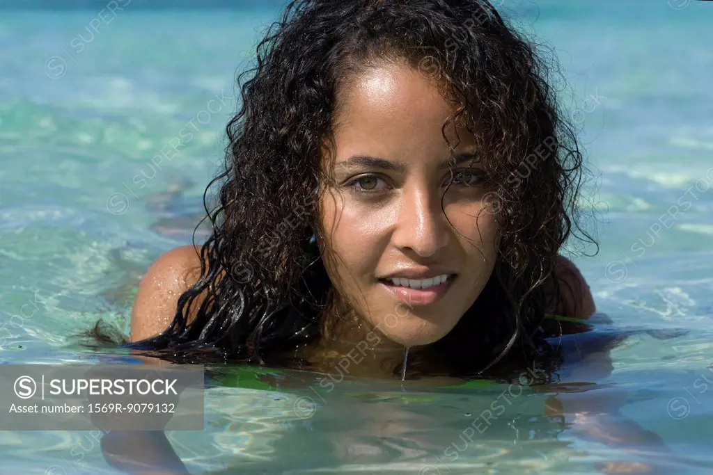 Young woman in water, portrait