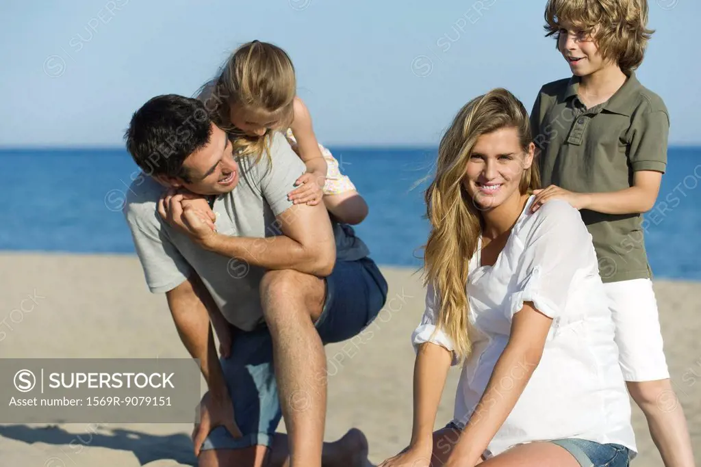 Family playing together at the beach