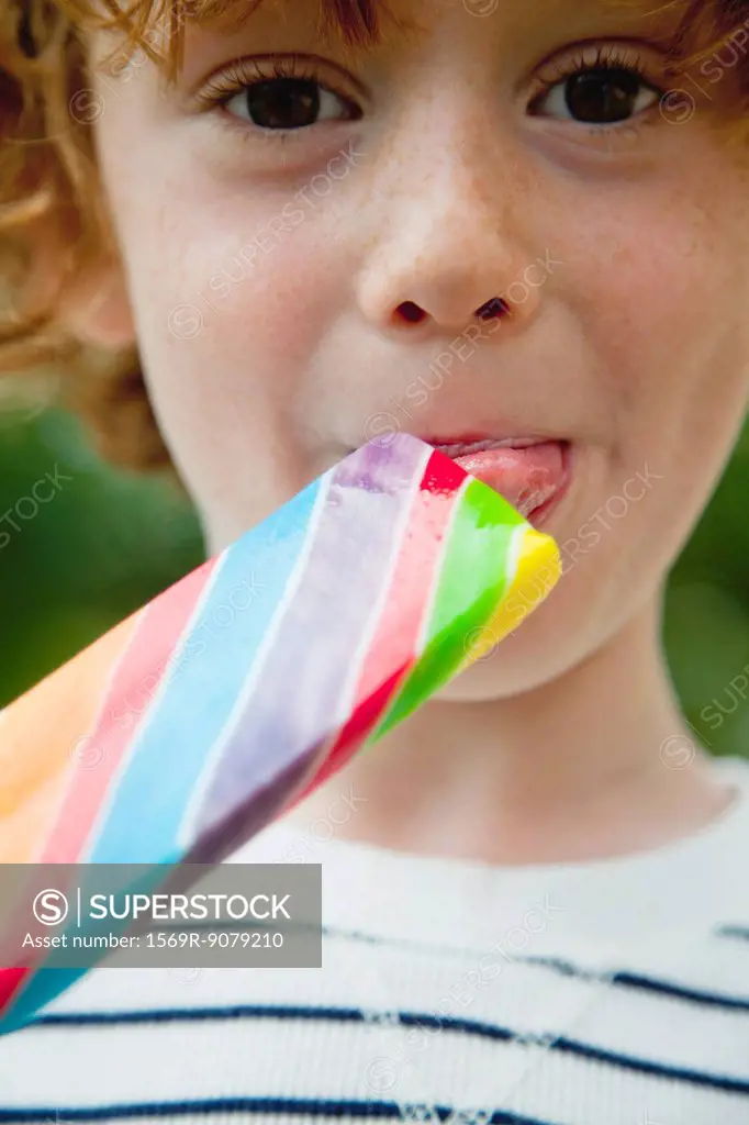 Boy eating lollipop