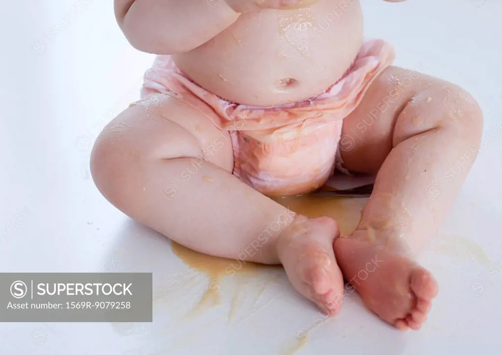 Infant covered in spilled food, low section