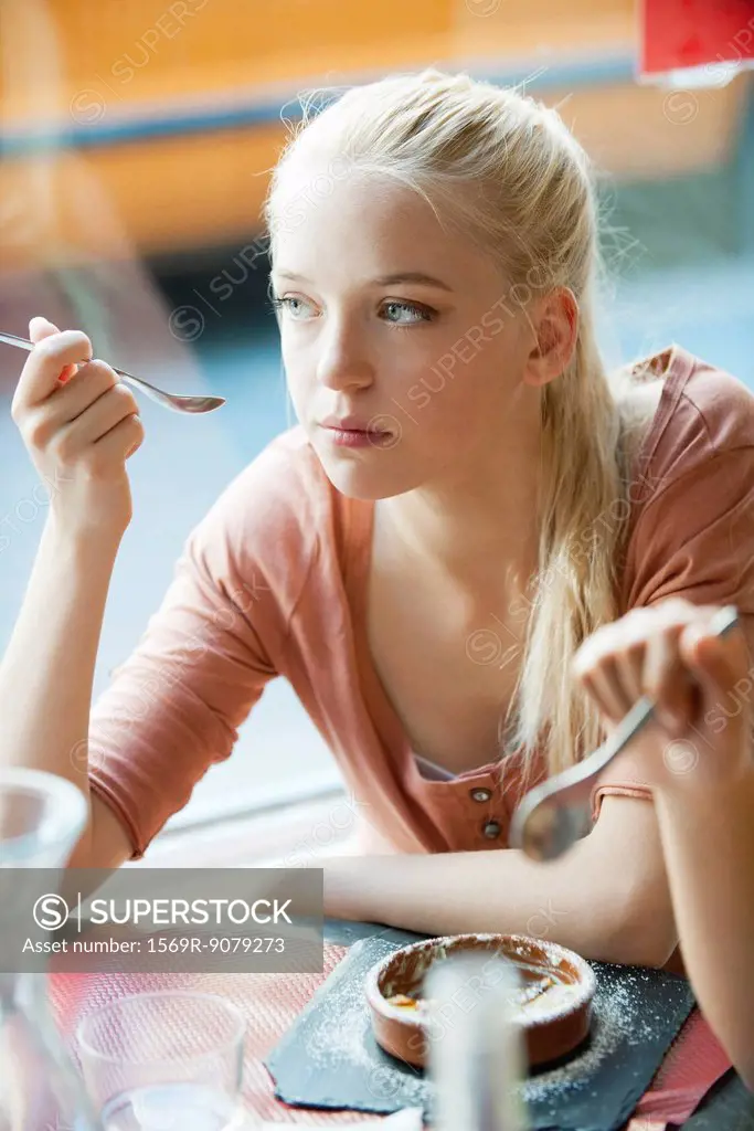 Young woman eating dessert