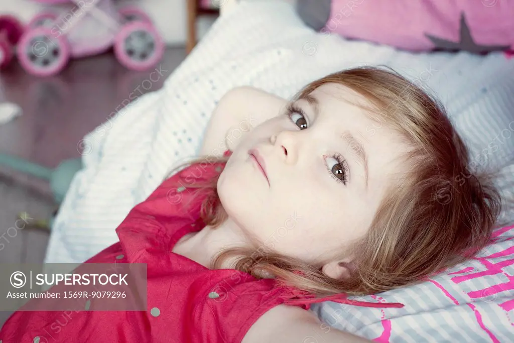 Little girl reclining, portrait