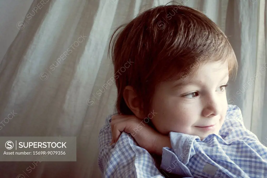 Boy daydreaming, portrait