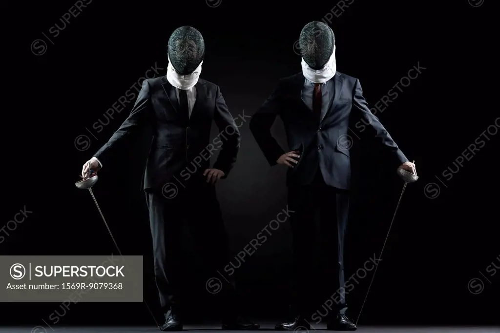 Businessmen with fencing masks and foils
