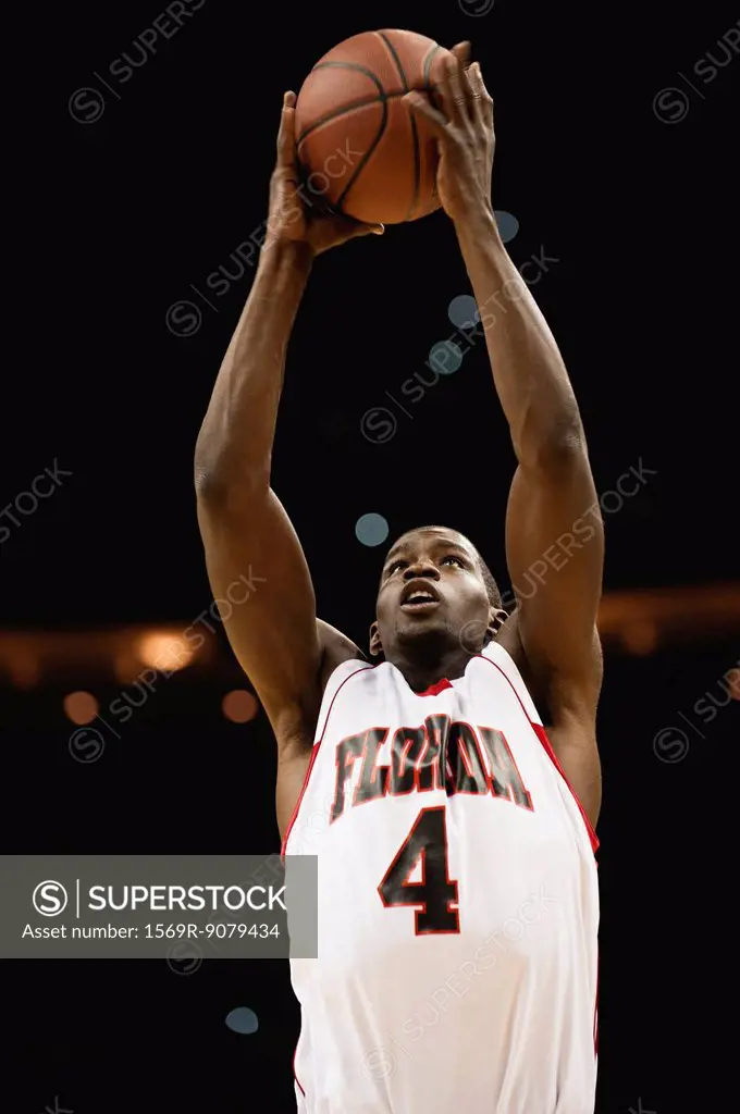 Basketball player catching ball