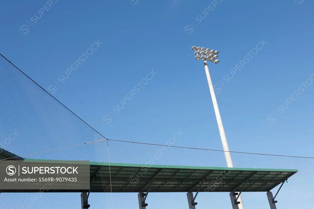 Stadium floodlights and netting