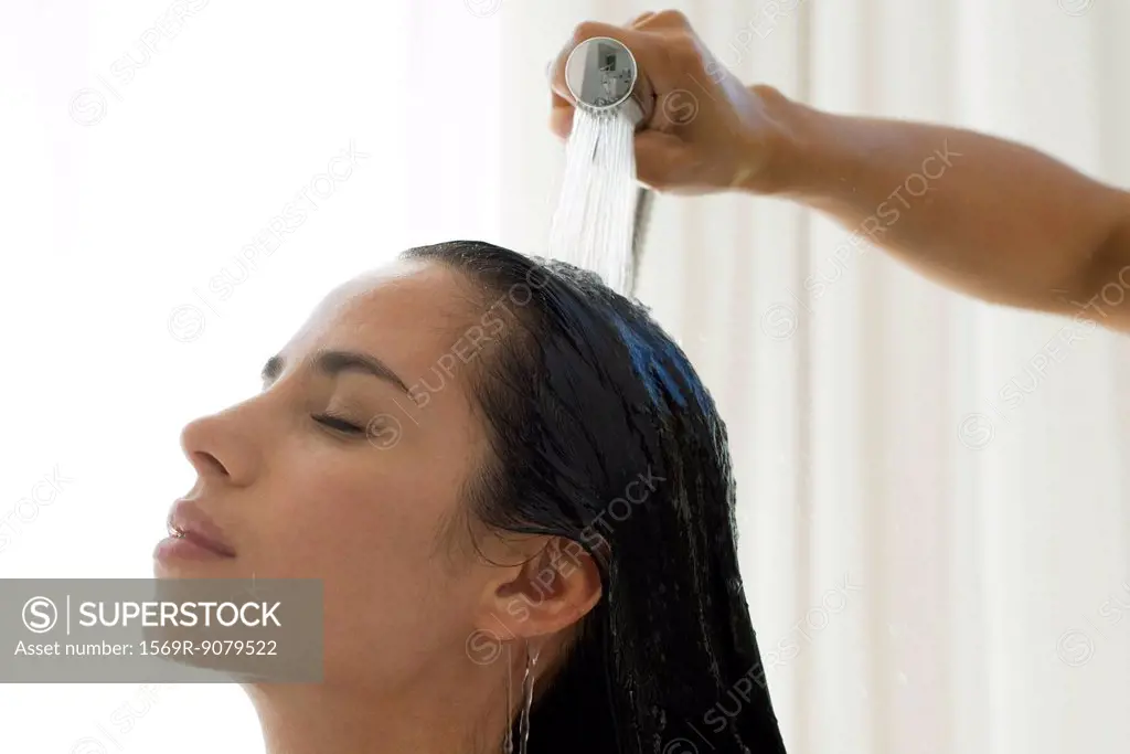 Woman having hair rinsed