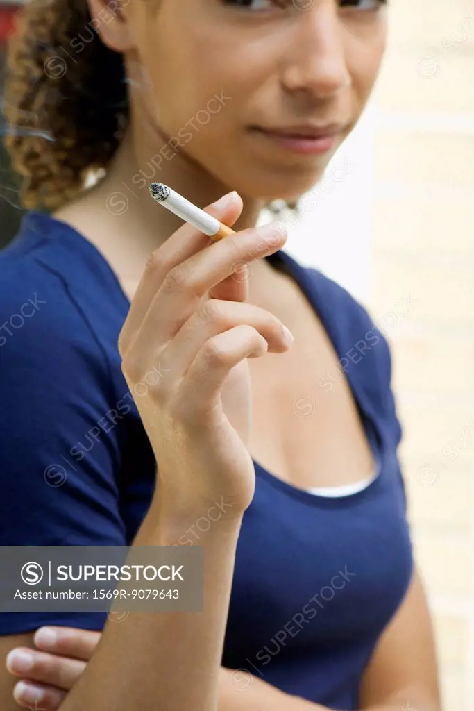 Young woman smoking cigarette