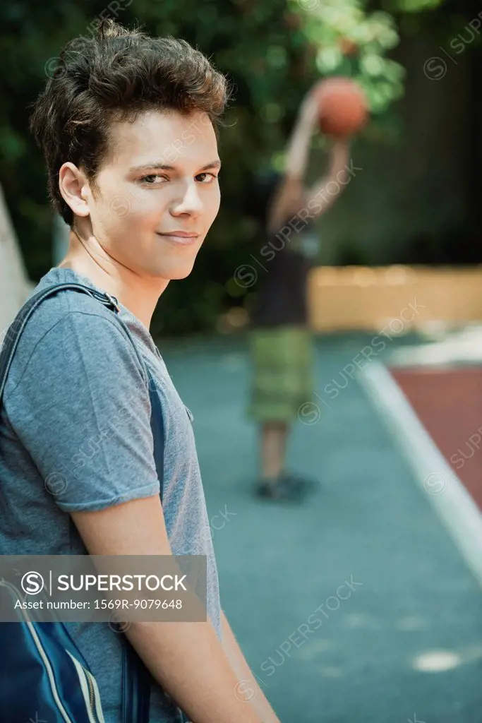 Young man smirking, portrait