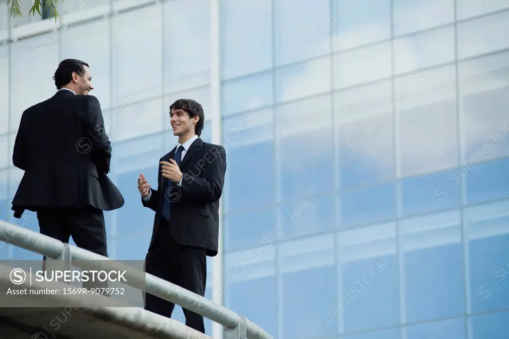 Businessmen talking together outdoors