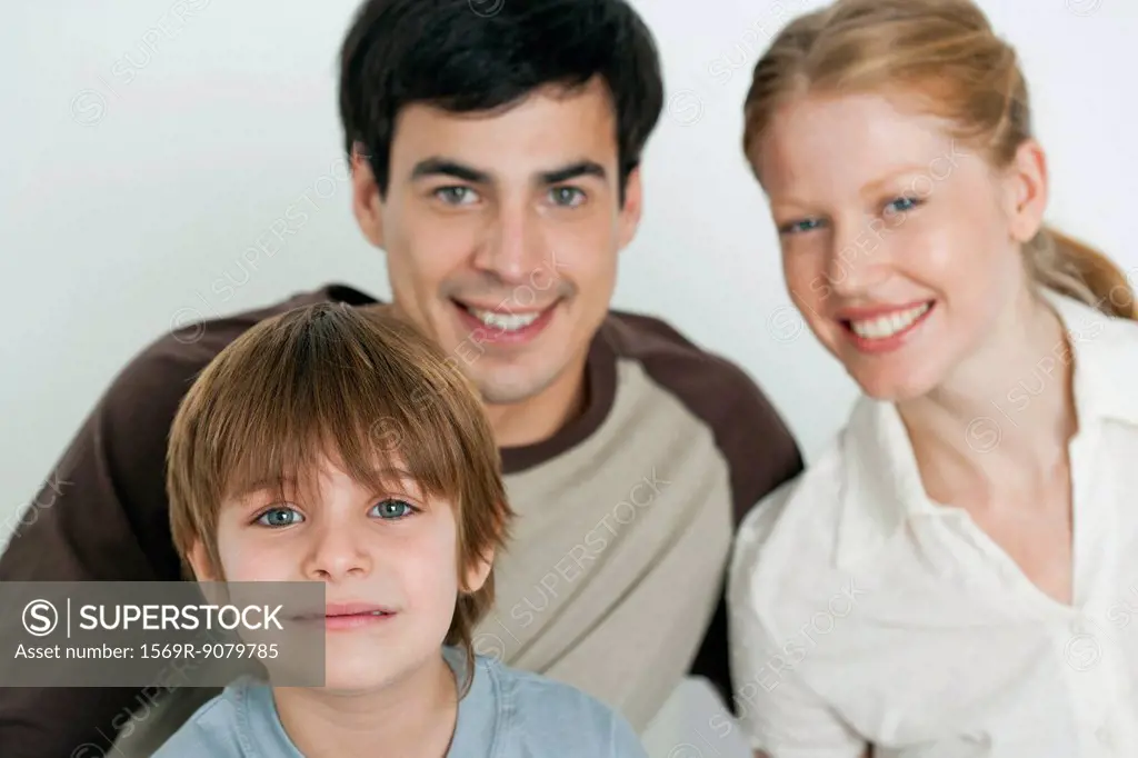Boy with parents, focus on foreground