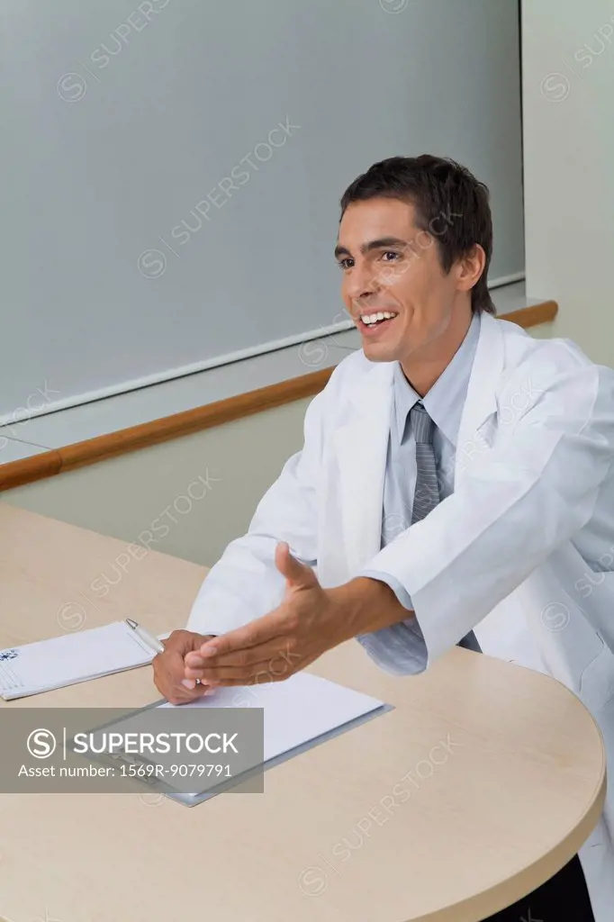 Doctor greeting patient in office