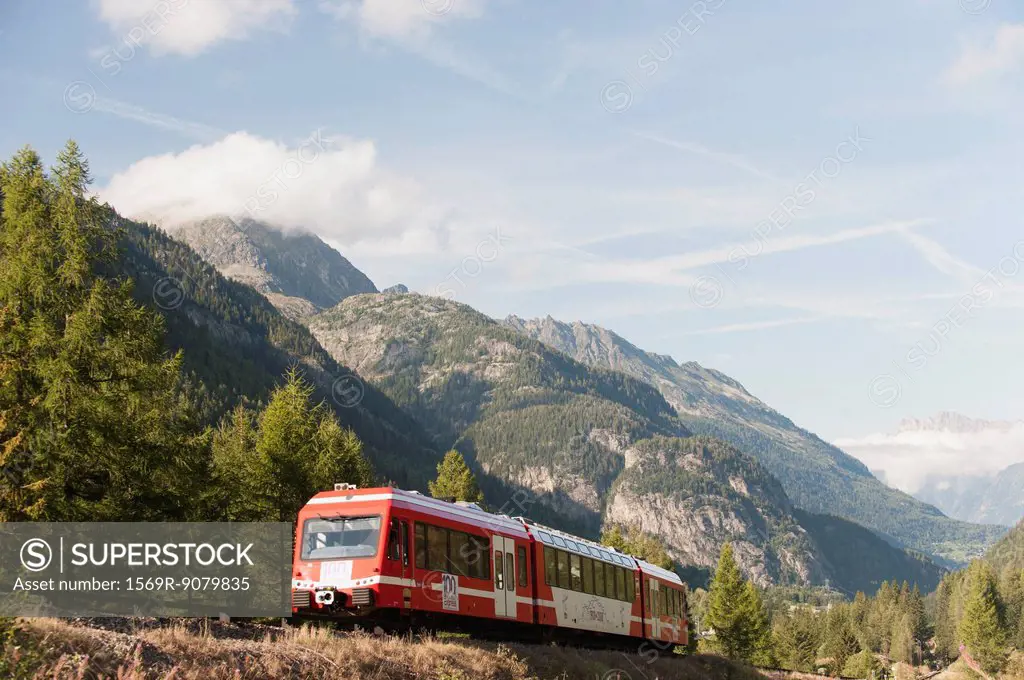 Train moving through mountain landscape