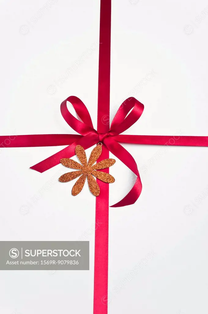 Red ribbon and bow on white background