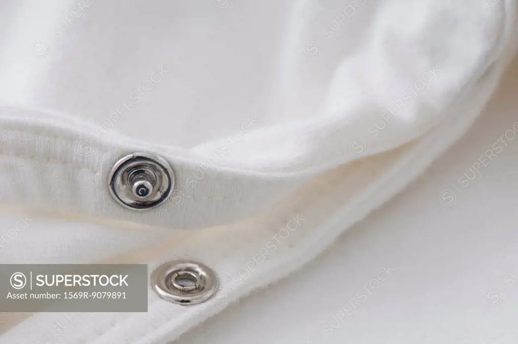 Close_up of snap fastener on clothing