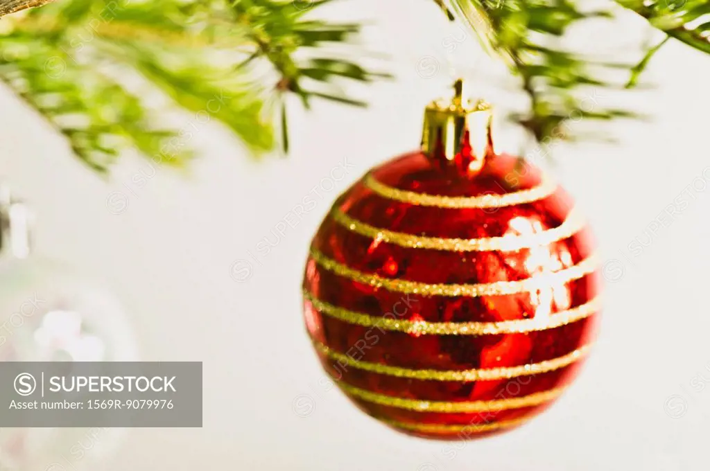 Christmas baubles hanging from Christmas tree, out of focus