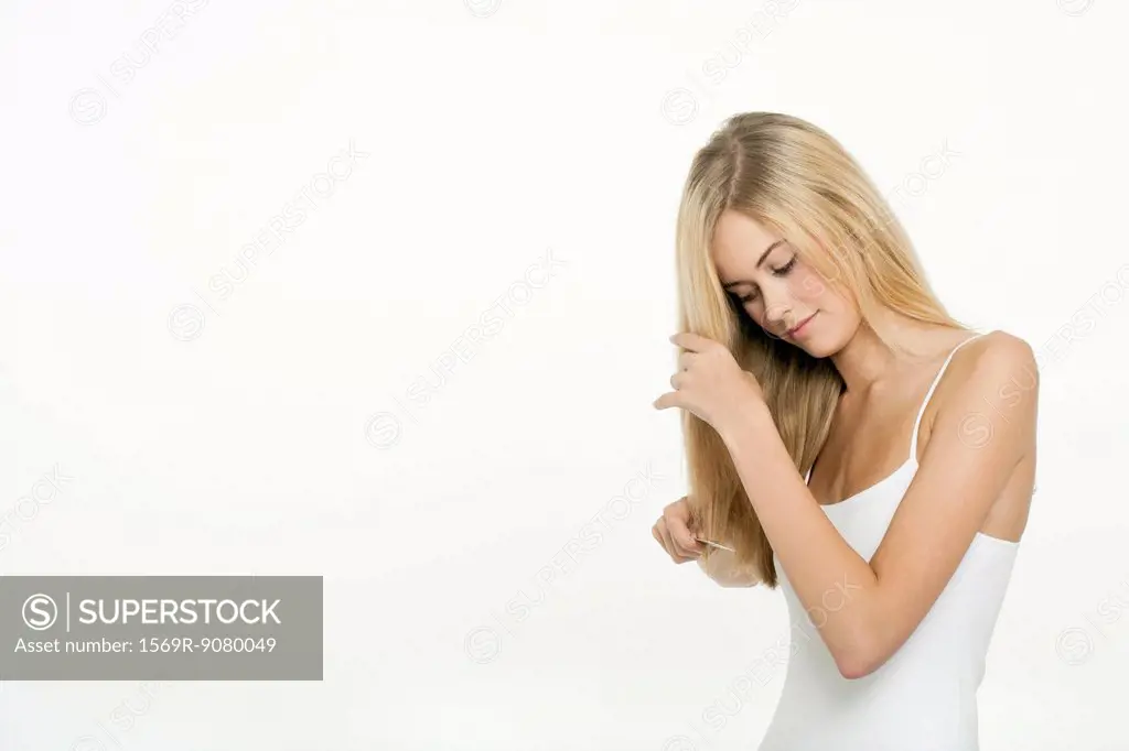Teen girl combing her hair
