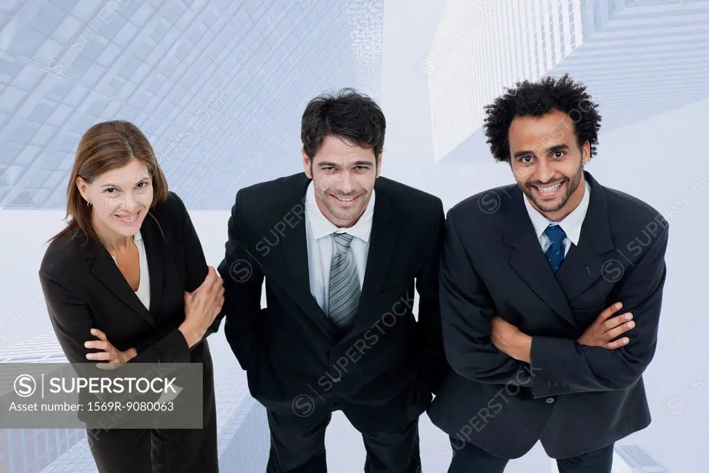 Team of executives smiling confidently with skyscrapers superimposed on background