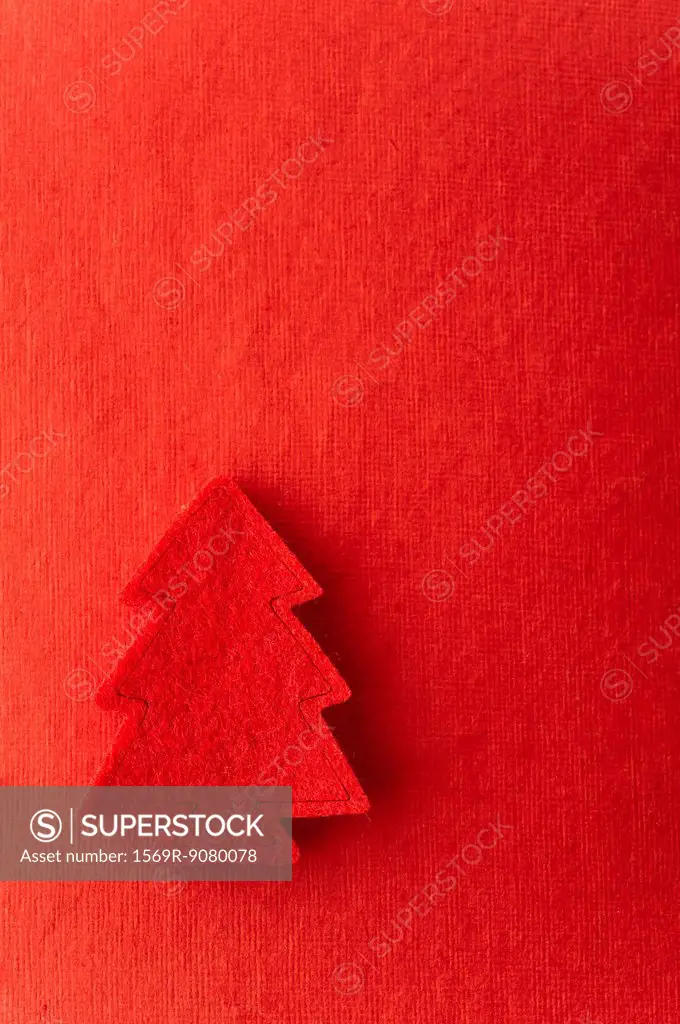 Christmas tree shape on red background
