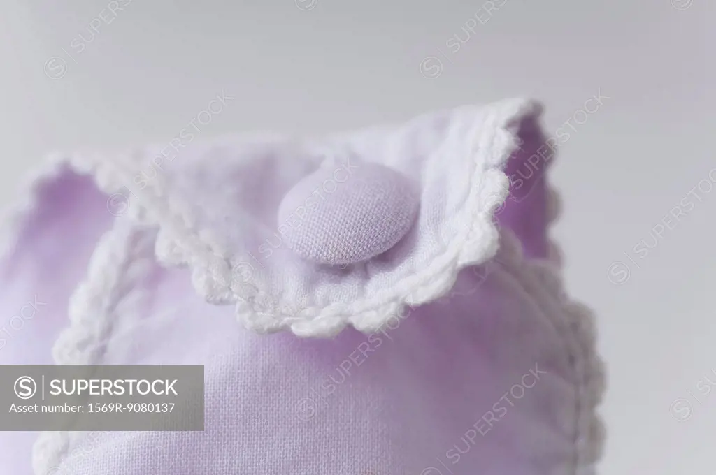 Close_up of button on baby clothing