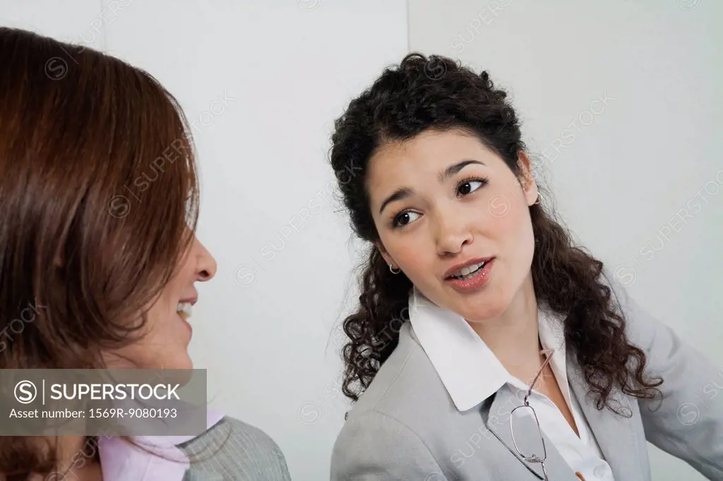 Businesswoman talking with colleague