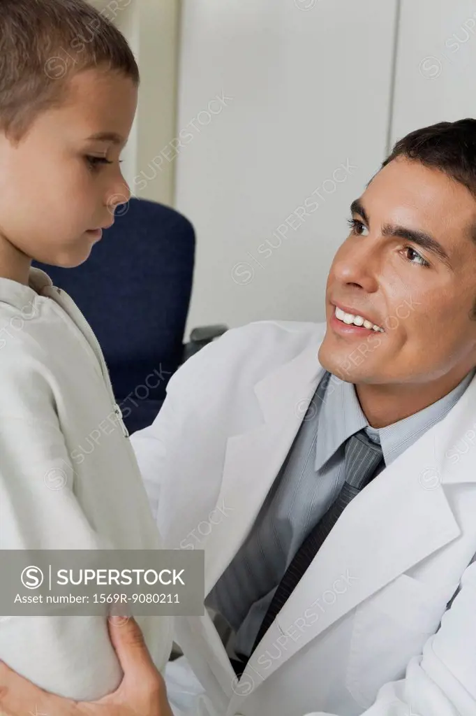 Doctor smiling at little boy