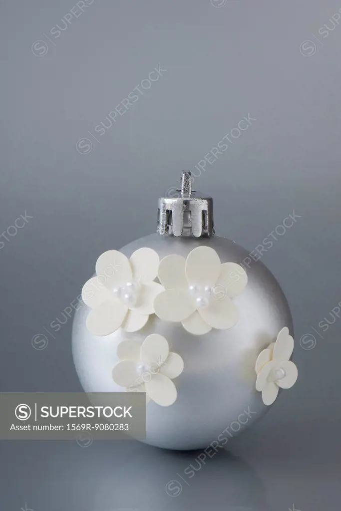 Silver Christmas ornament decorated with flowers