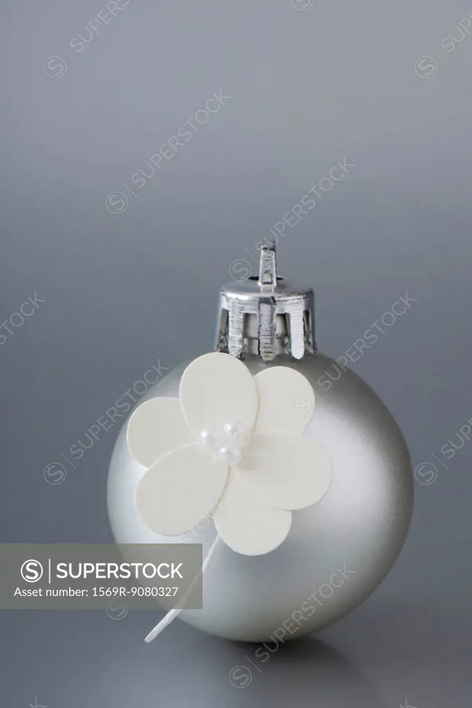 Silver Christmas ornament decorated with flowers