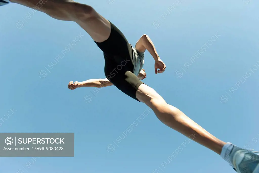 Man jumping in air, directly below
