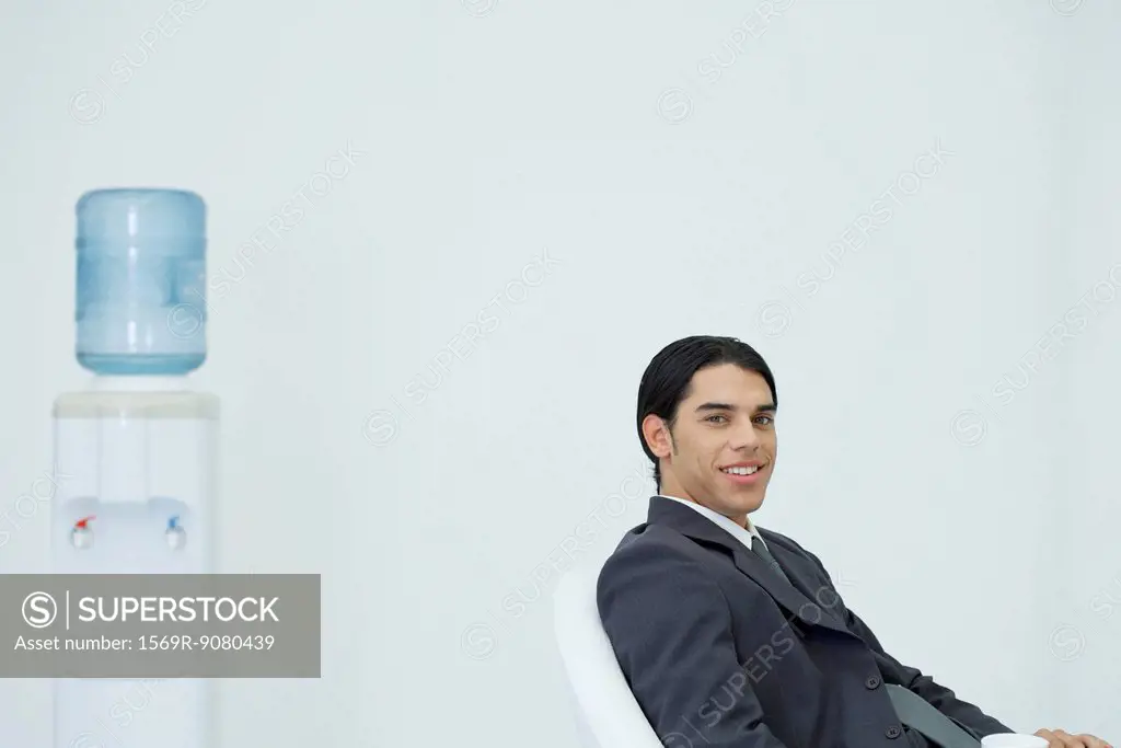 Young businessman taking a coffee break