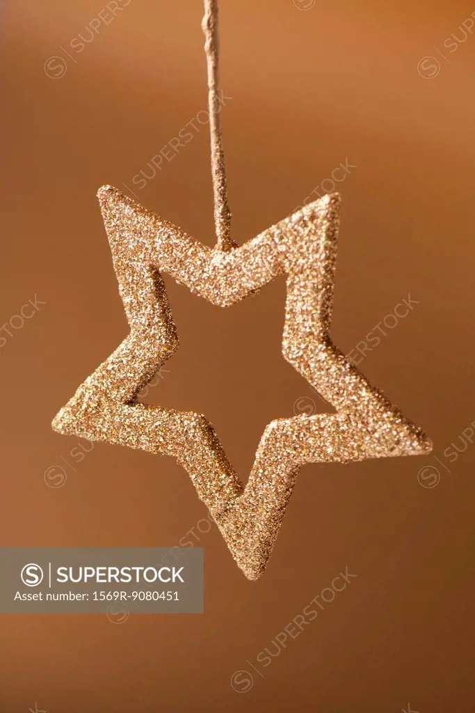 Golden star shaped Christmas ornament