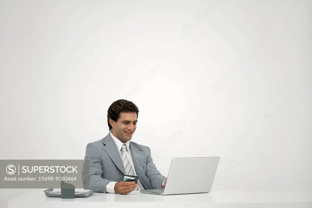 Businessman shopping online with credit card
