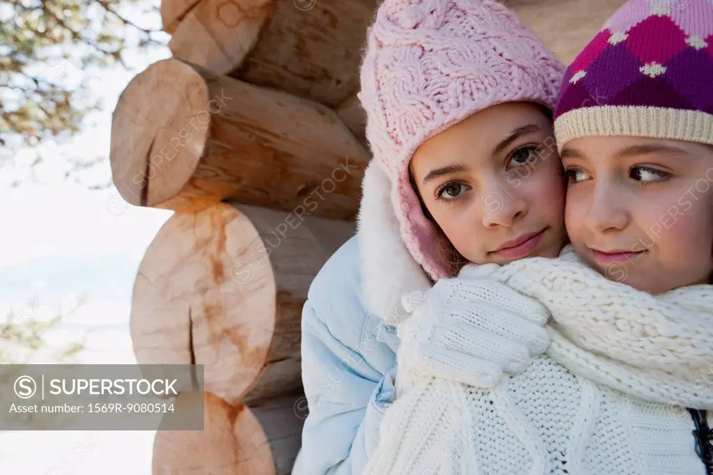 Sisters together outdoors, portrait