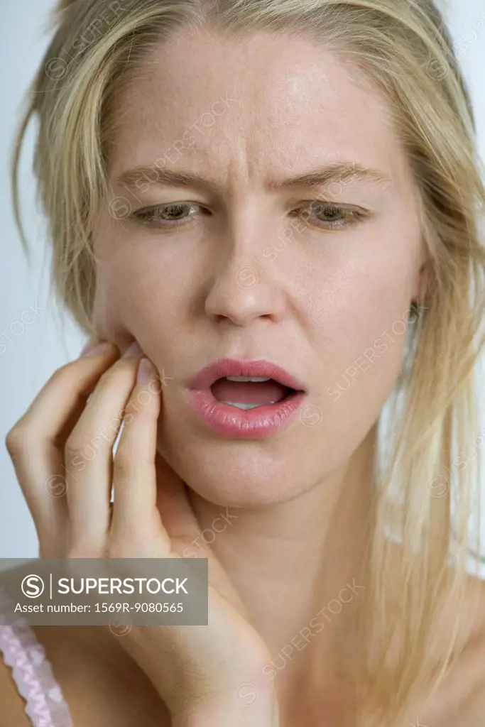 Young woman with toothache