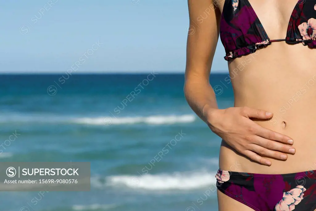 Woman in bikini, mid section