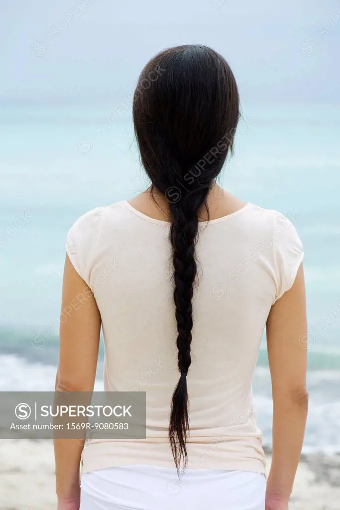 Woman with long braid, rear view